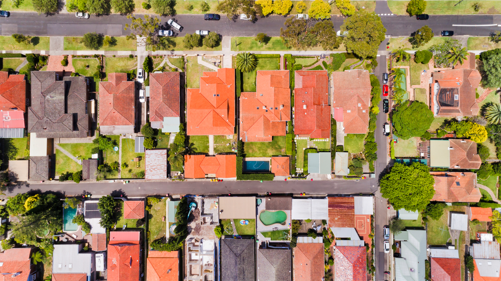 Aerial view of an Australian suburb showing homes including duplexes.